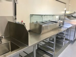 Inside view of the Ban Mi An food truck's kitchen.