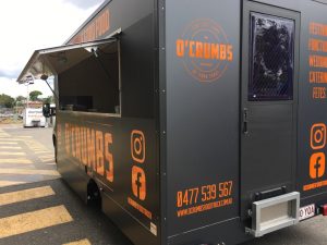 Side view of the O'Crumbs food truck.