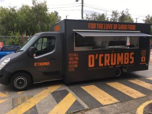 Side view of the O'Crumbs food truck.