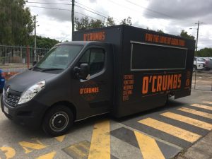 Side view of the O'Crumbs food truck.