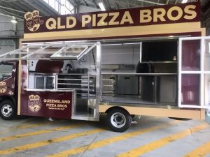 Side view of the QLD Pizza Bros food truck.