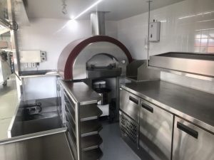 Inside view of the QLD Pizza Bros food truck kitchen.