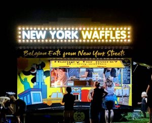 Night view of the New York Waffles food trailer.