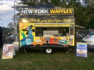 Side view of the New York Waffles food trailer.