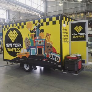 Behind view of the New York Waffles food trailer.