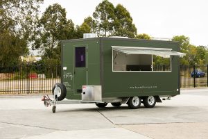 Side view of House of Harvey’s catering van.