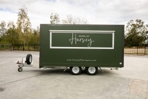 Side view of House of Harvey’s catering van.