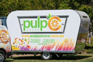 Side view of Pulp Juice Co's juice van.