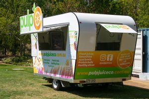 Side view of Pulp Juice Co's juice van.