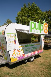 Side view of Pulp Juice Co's juice van.