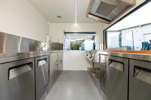 Inside view of the Radical Eats food trailer kitchen.