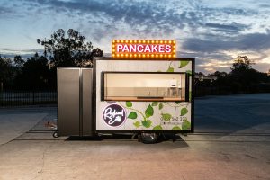 Side view of the Radical Eats food trailer.