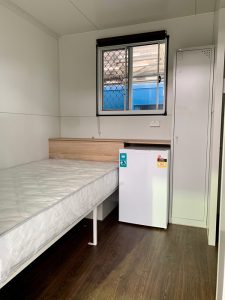 Inside view of the Room2Move accommodation trailer bedroom.