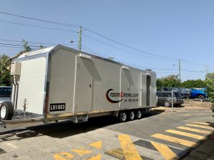Side view of the Room2Move accommodation trailer.