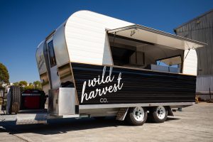 Side view of the Wild Harvest food van.