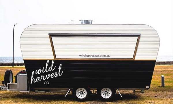 Side view of the Wild Harvest food van.