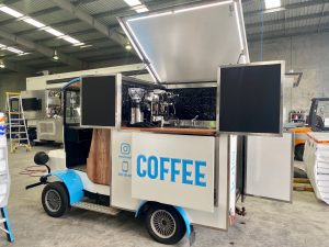 Side view of the Bolwell Brew coffee cart.