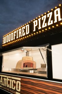 Side view of the Antico woodfire pizza truck.