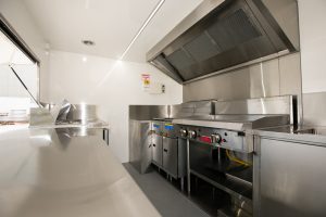 Inside view of the Kickass Catering truck kitchen.