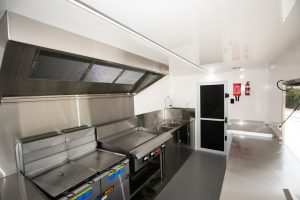 Inside view of the Kickass Catering truck kitchen.