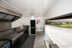 Inside view of the Kickass Catering truck kitchen.