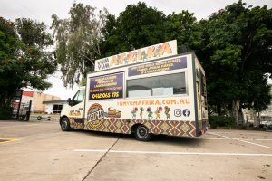 Side view of the Yum Yum Afrika food truck.