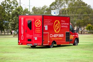 Side view of the Chef 365 catering van.